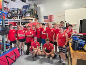 KidZone Party Rentals staff posing together in red shirts