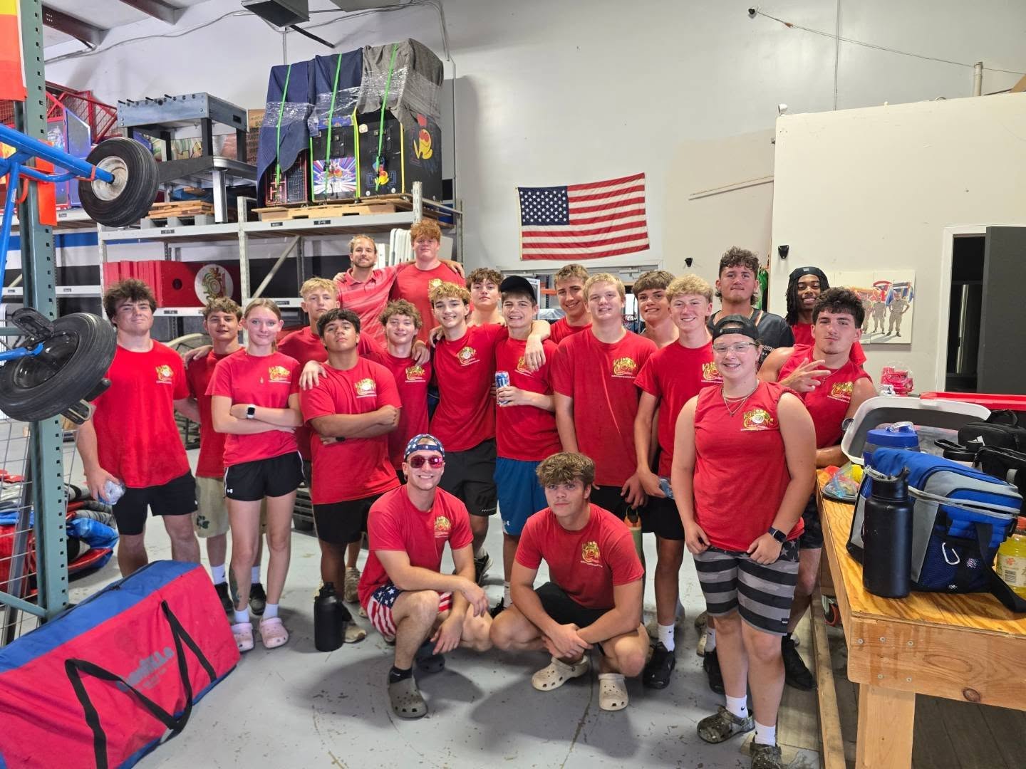 KidZone Party Rentals staff posing together in red shirts
